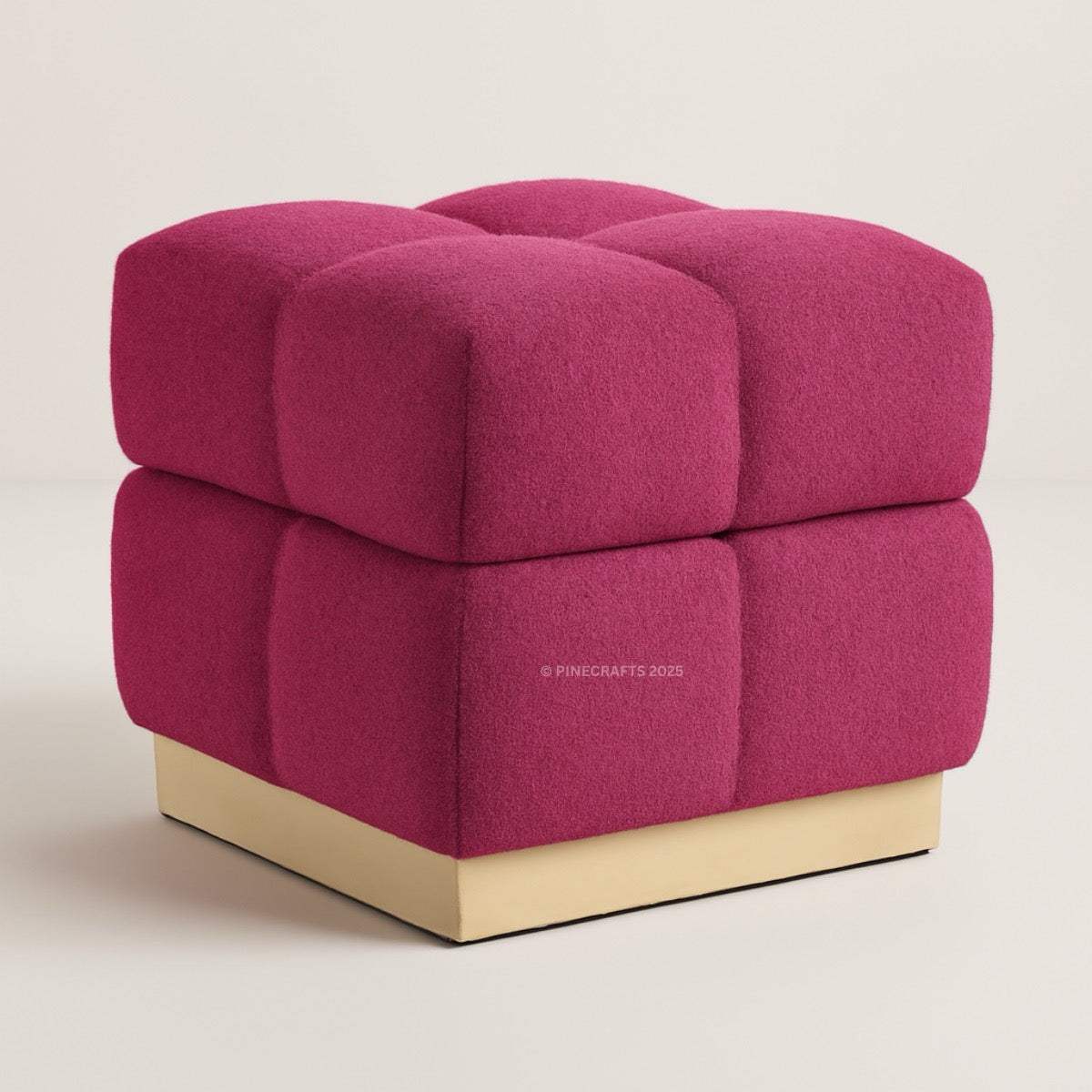 Pink cube-shaped ottoman on a beige background