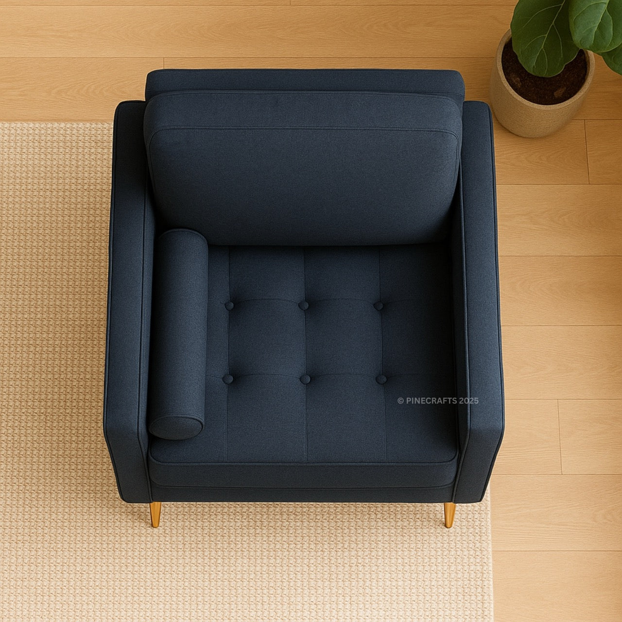 Blue armchair on a wooden floor with a plant in the corner