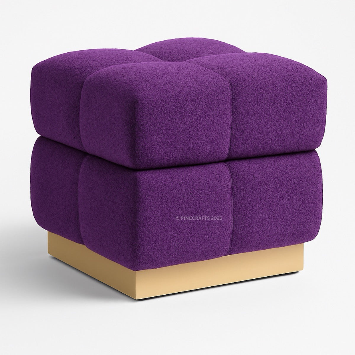 Purple cube-shaped ottoman with a gold base on a white background