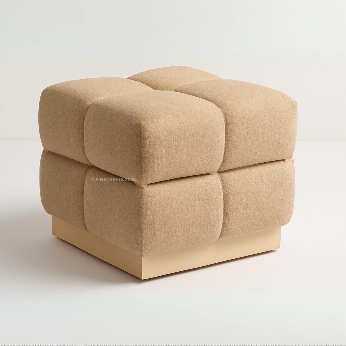 Beige cube-shaped ottoman on a white background