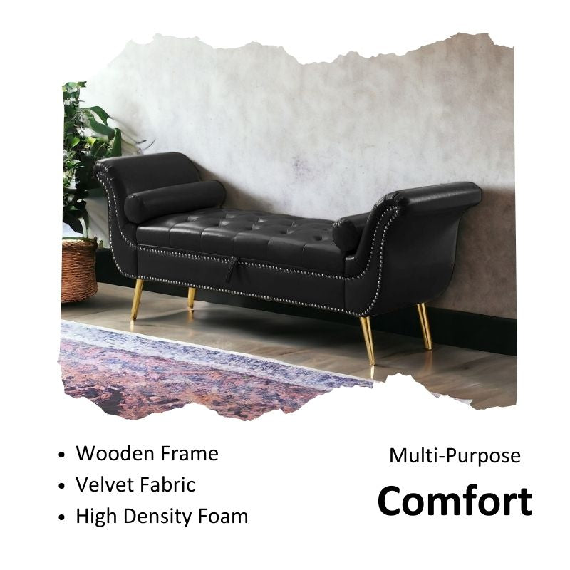 A black velvet button tufted 3-seater sofa with gold legs, placed in a living room setting with a grey throw blanket and a decorative plant in the background.