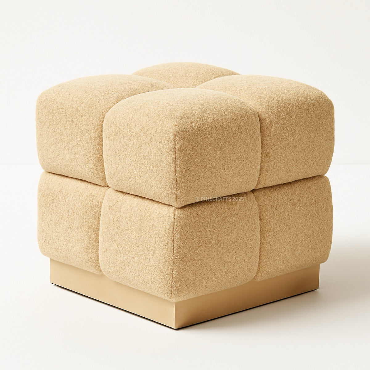 Beige cube-shaped ottoman on a white background