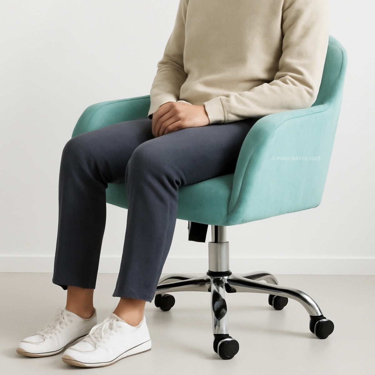 Person sitting on a light blue office chair with a white background
