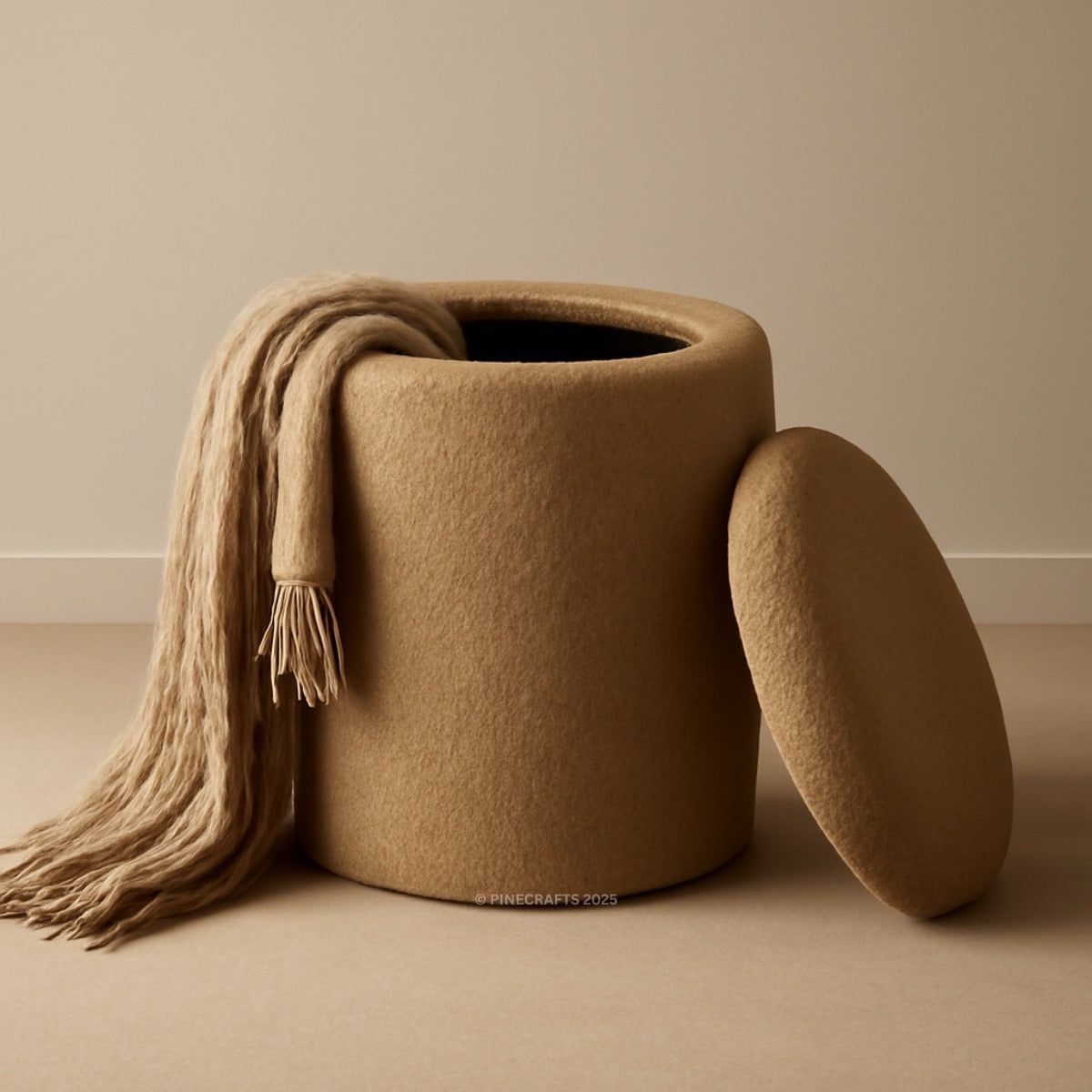Brown felted storage basket with a matching cover and a beige scarf draped over it on a beige background.
