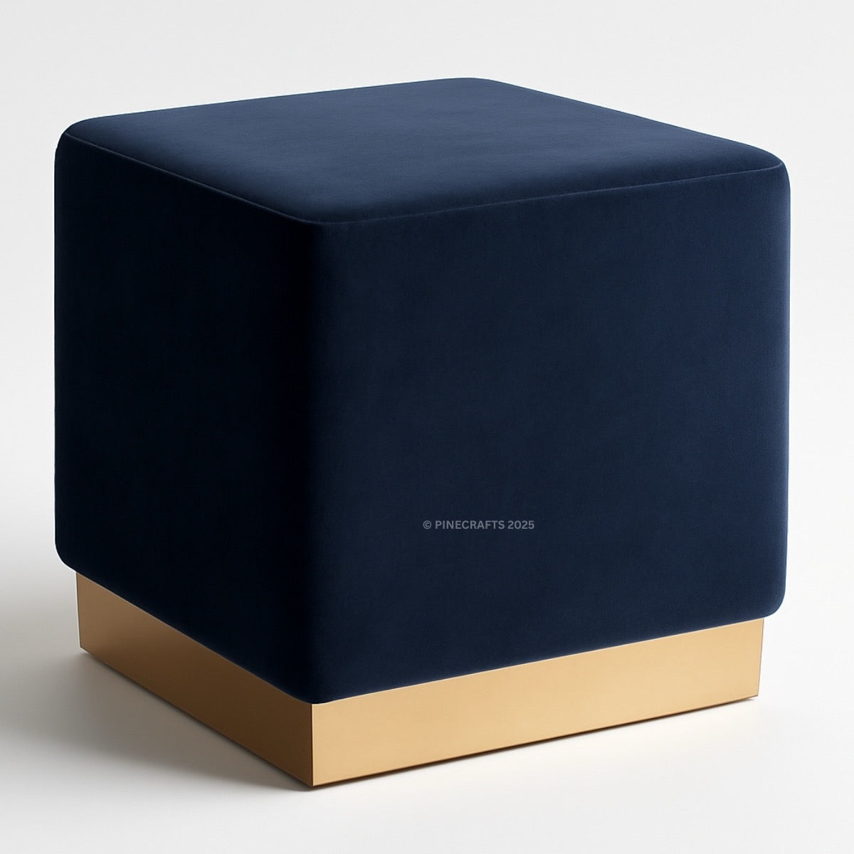 Blue cube-shaped ottoman with gold base on a white background