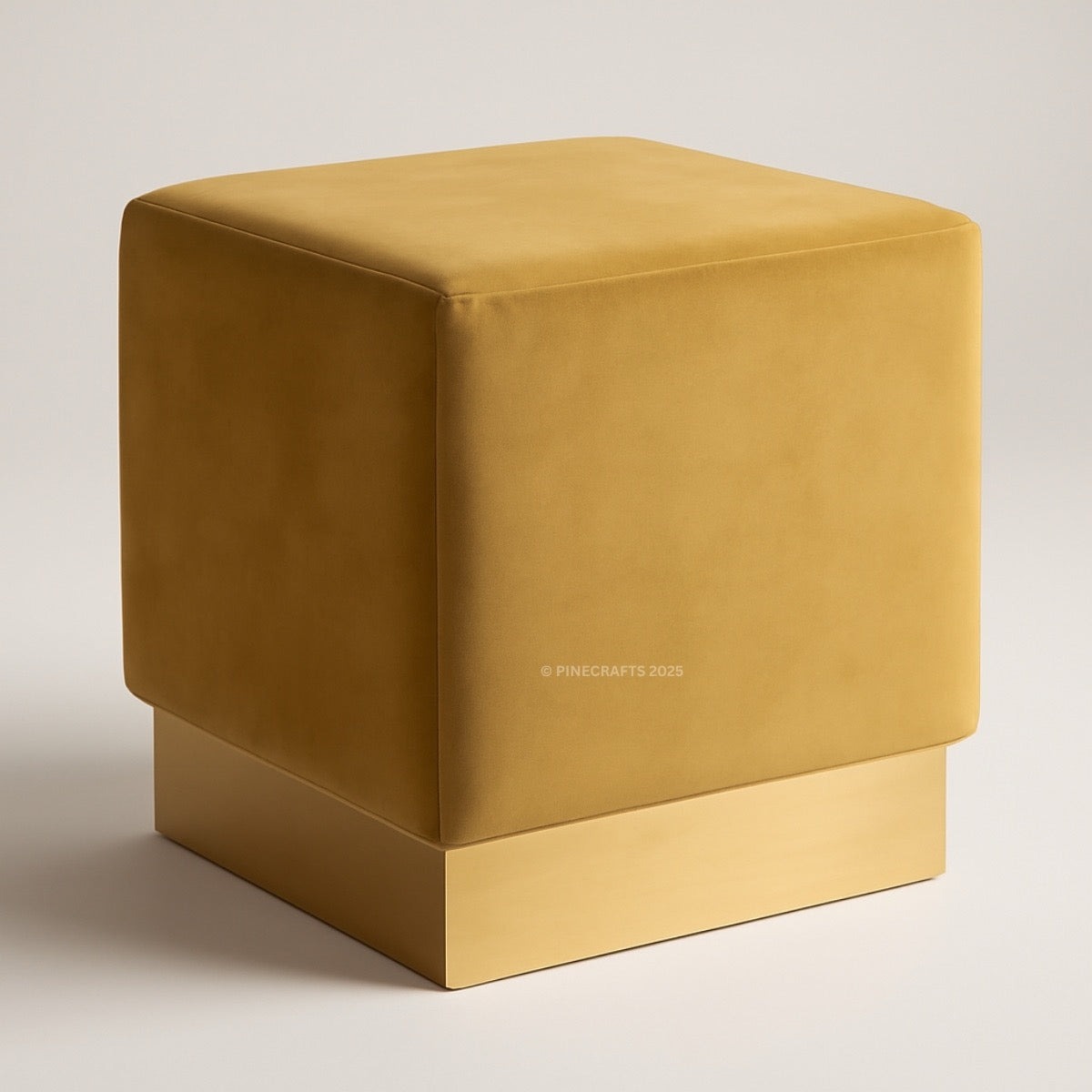 Mustard yellow cube-shaped ottoman on a light gray background