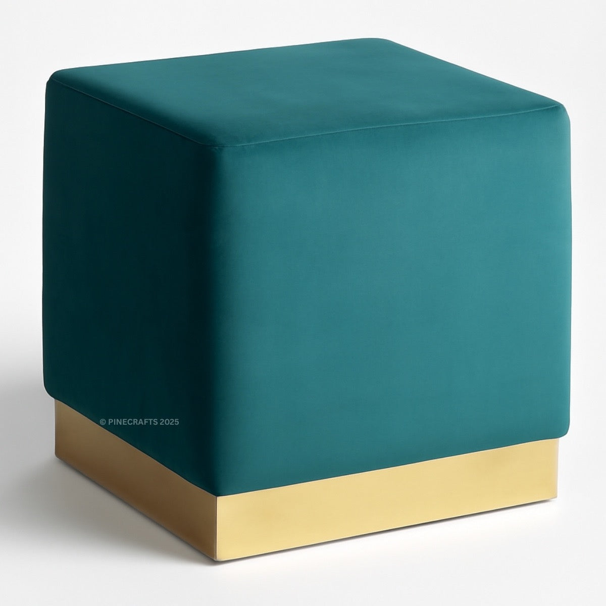 Teal cube-shaped ottoman with a gold base on a white background
