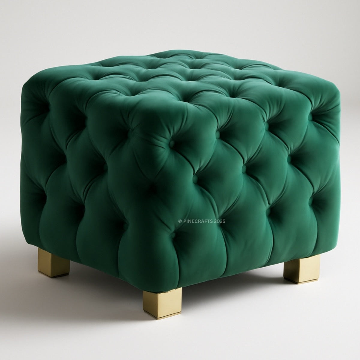 Green tufted ottoman with gold legs on a white background
