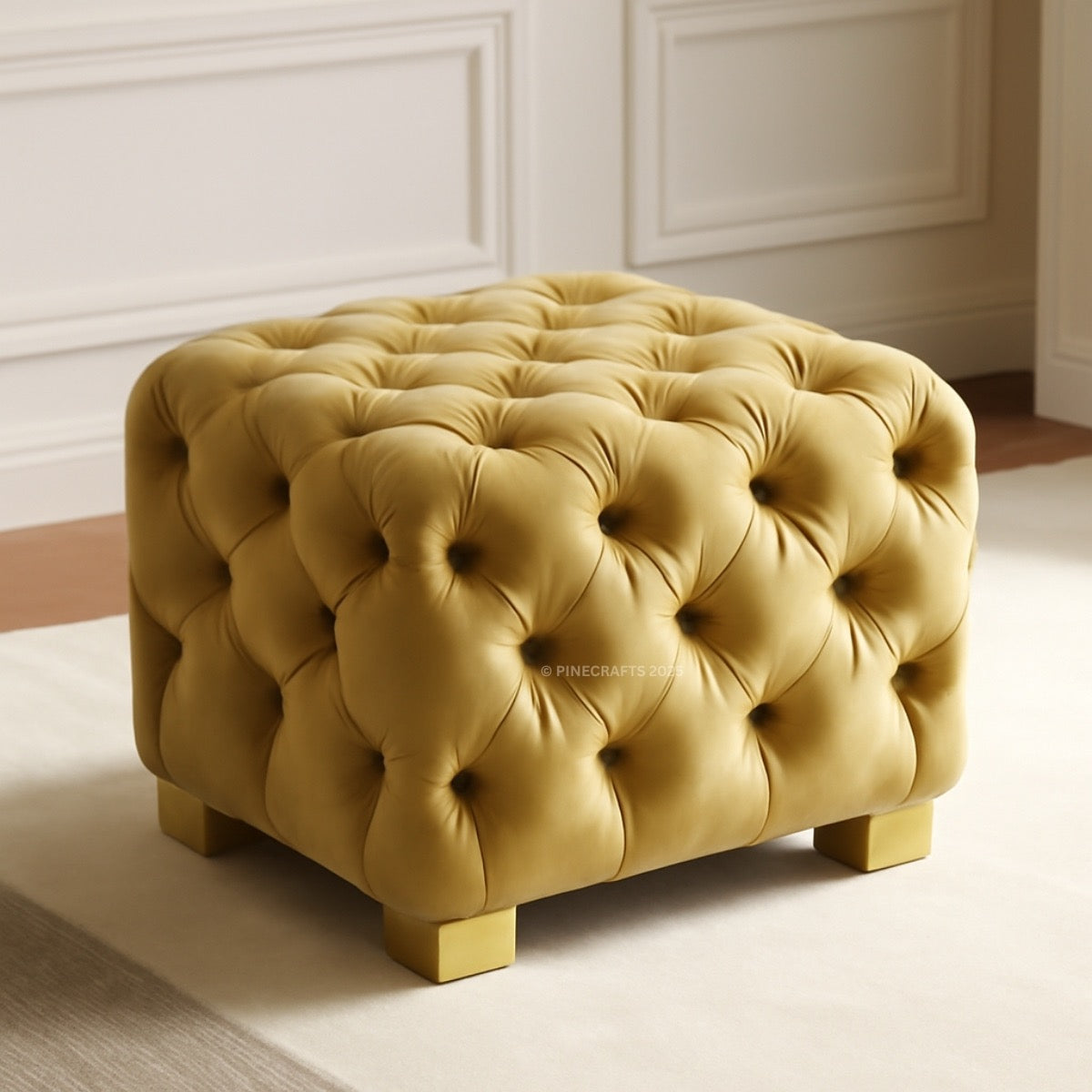 Yellow tufted ottoman in a room with white paneled walls.