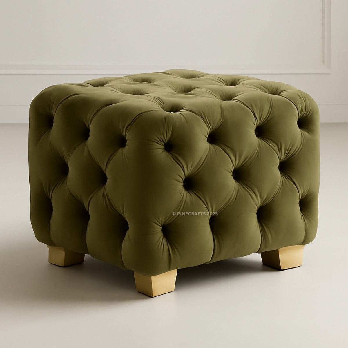 Green tufted ottoman on a plain background