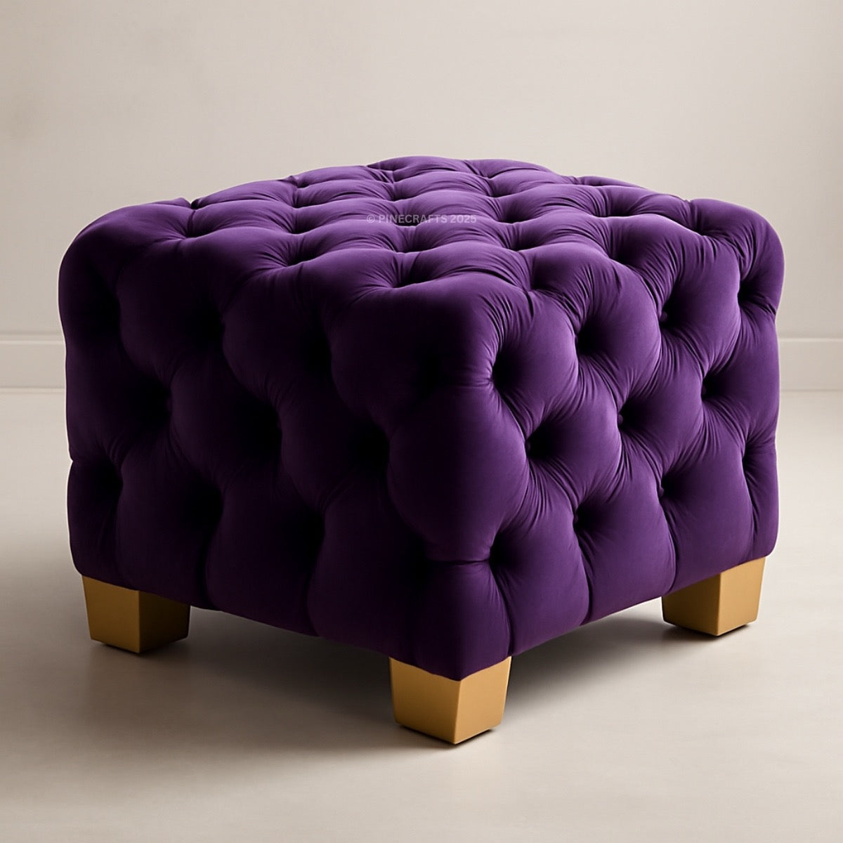 Purple tufted ottoman with wooden legs on a neutral background