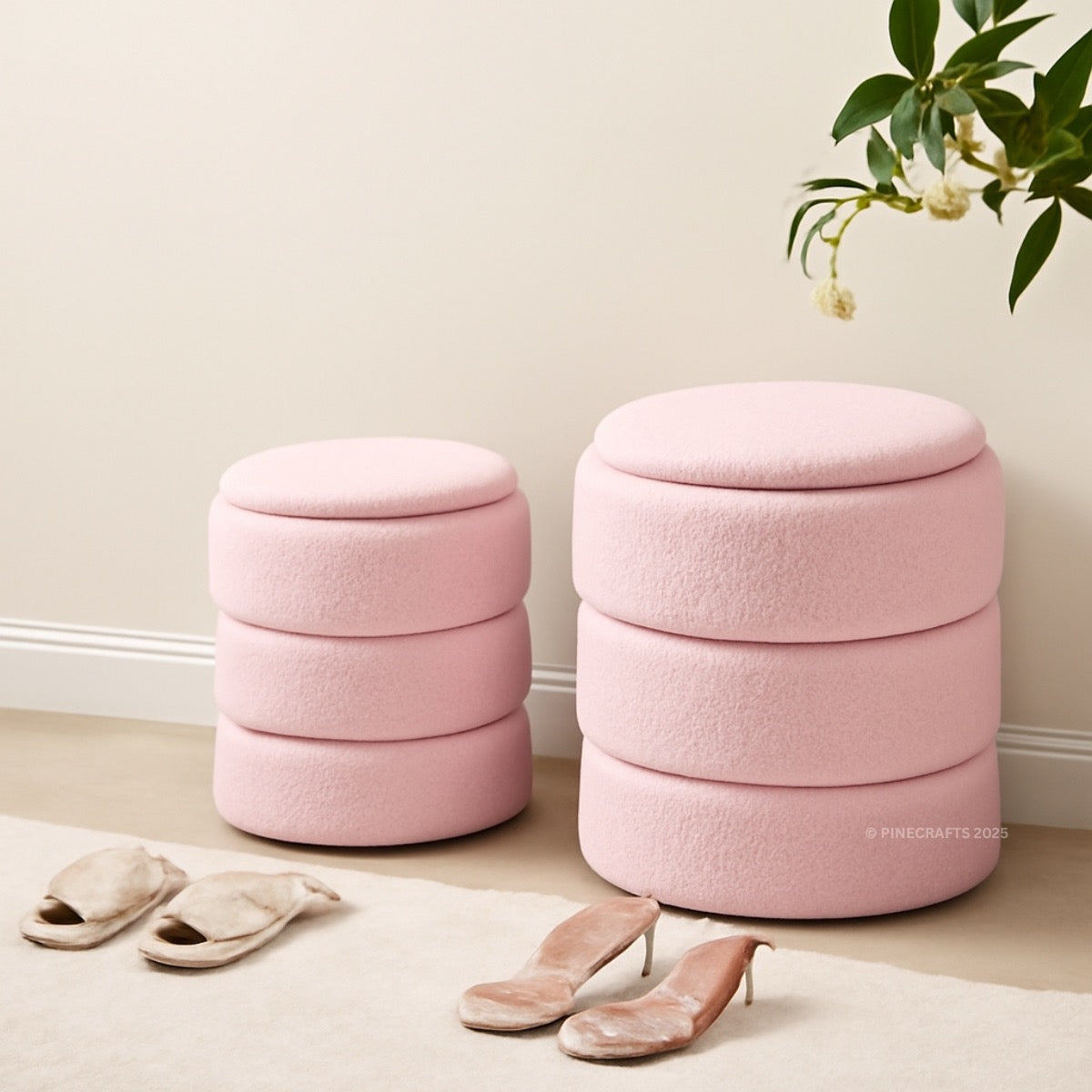 Two pink ottomans with stacked design in a room setting.