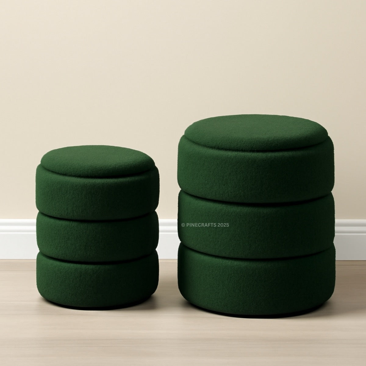 Two green ottomans stacked on a beige floor with a plain wall background
