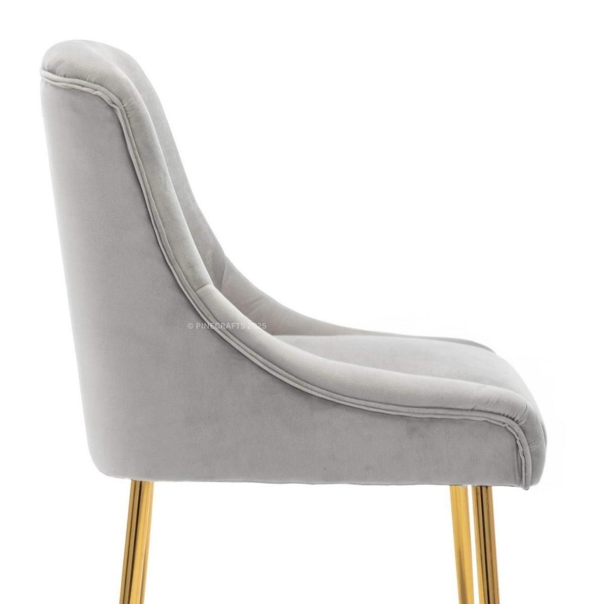 Gray velvet chair with gold legs on a white background