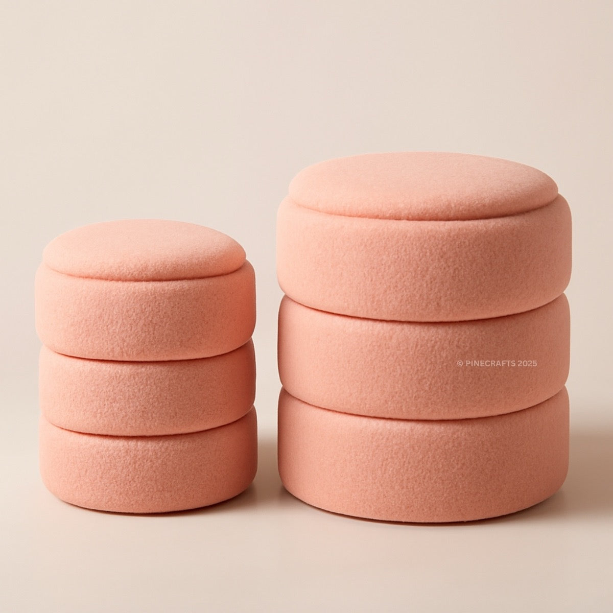 Set of pink fabric containers stacked on a beige background