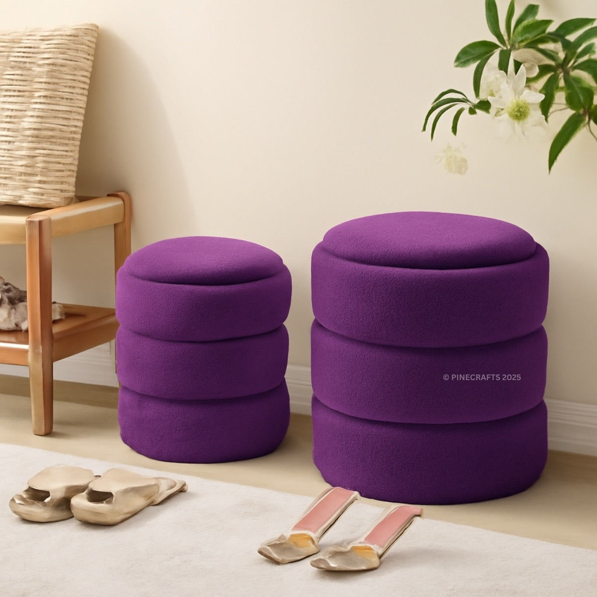 Two purple ottomans in a room with a wooden chair and plant.