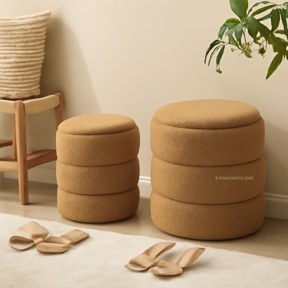 Two brown ottomans on a light wooden floor with a plant and basket in the background.