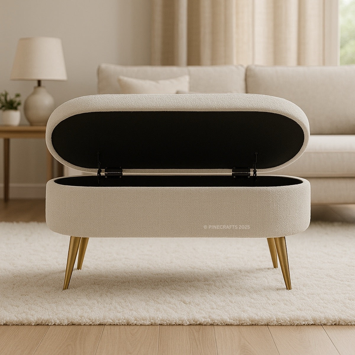 Beige storage bench with gold legs in a living room setting
