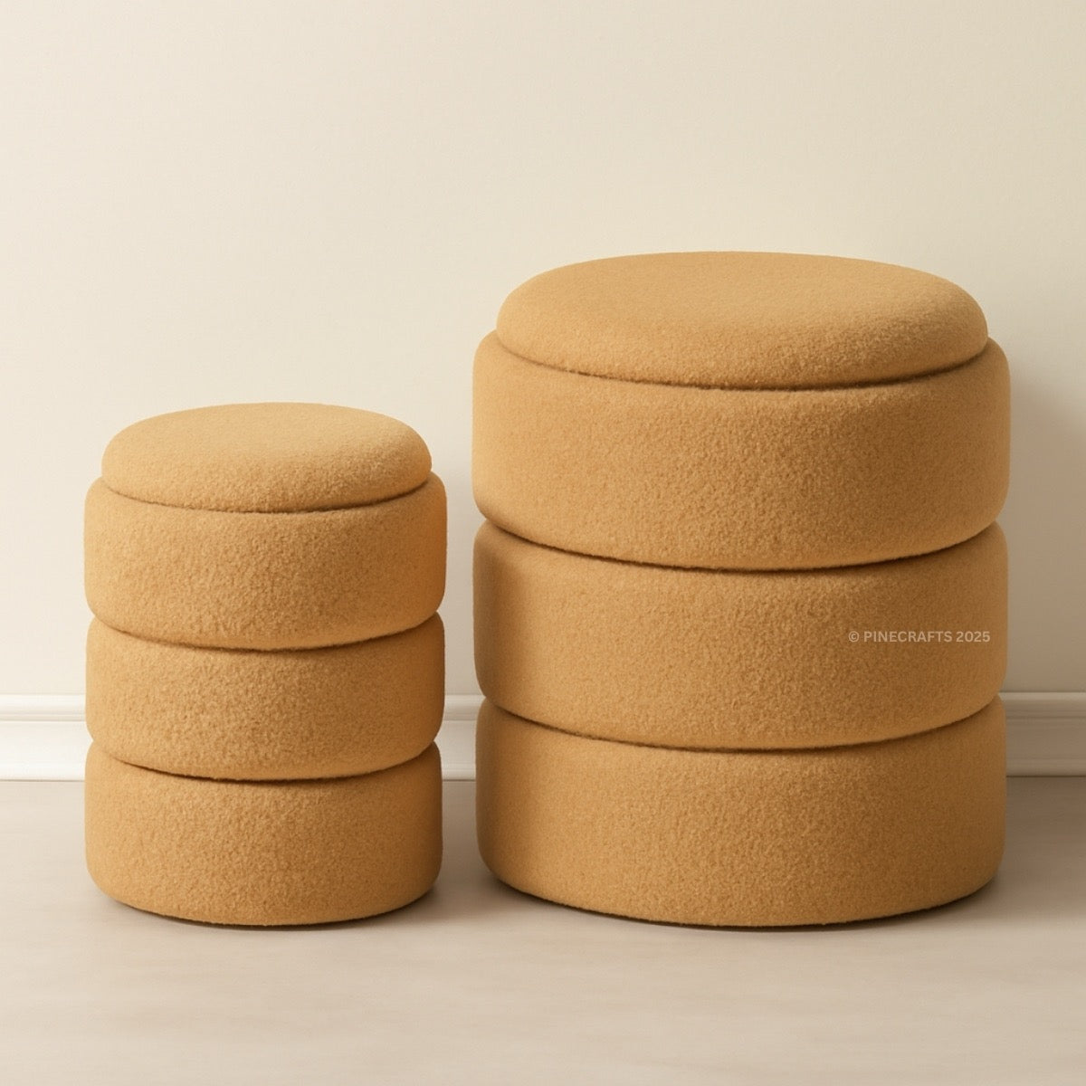 Set of three mustard yellow ottomans stacked against a beige wall.