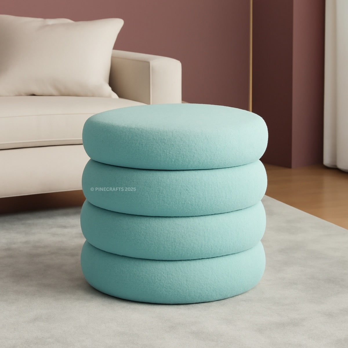 Stack of light blue ottomans in a living room setting with a beige sofa.