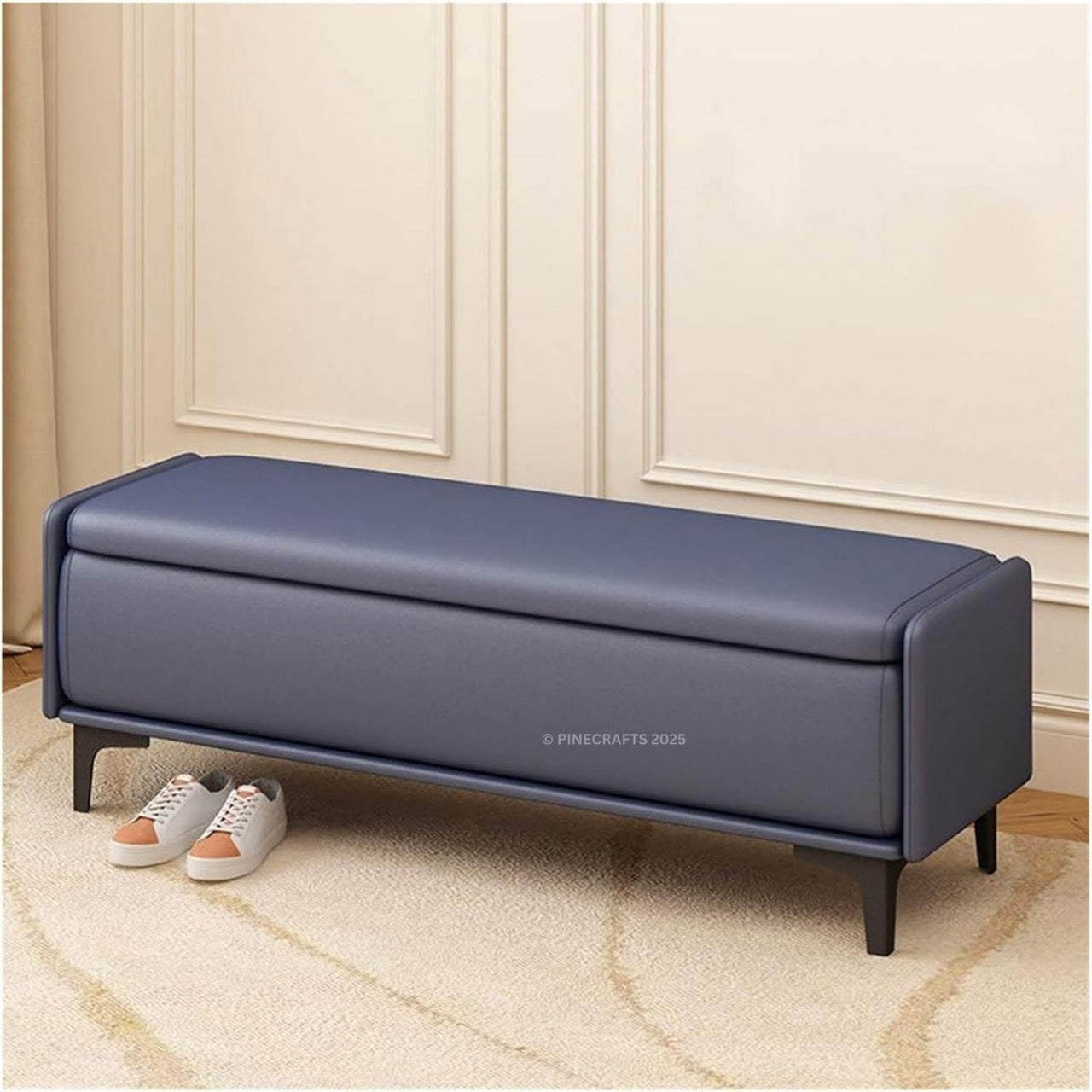 Blue storage bench in a room with beige walls and carpet.