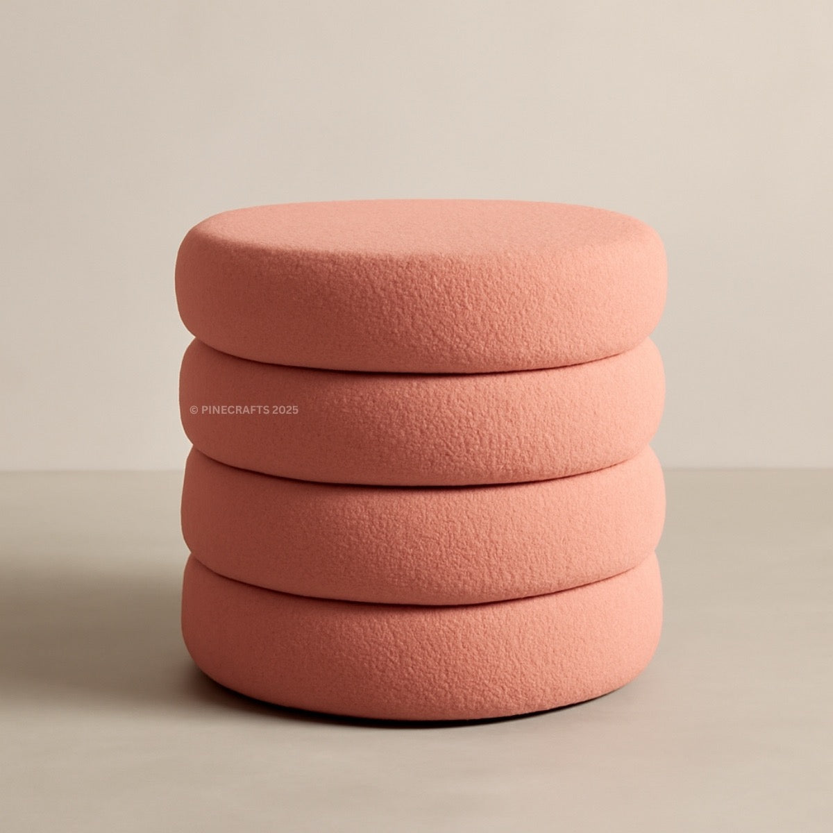 Stack of pink cushions on a beige background