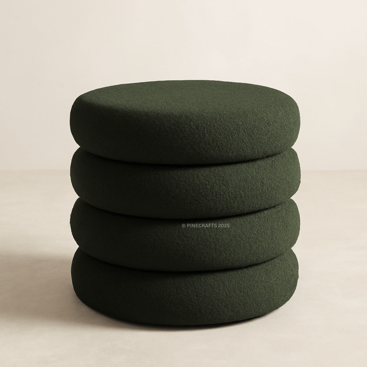 Stack of green cushions on a beige background