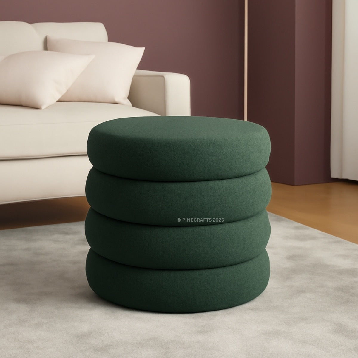 Green ottoman with stacked cylindrical design in a living room setting
