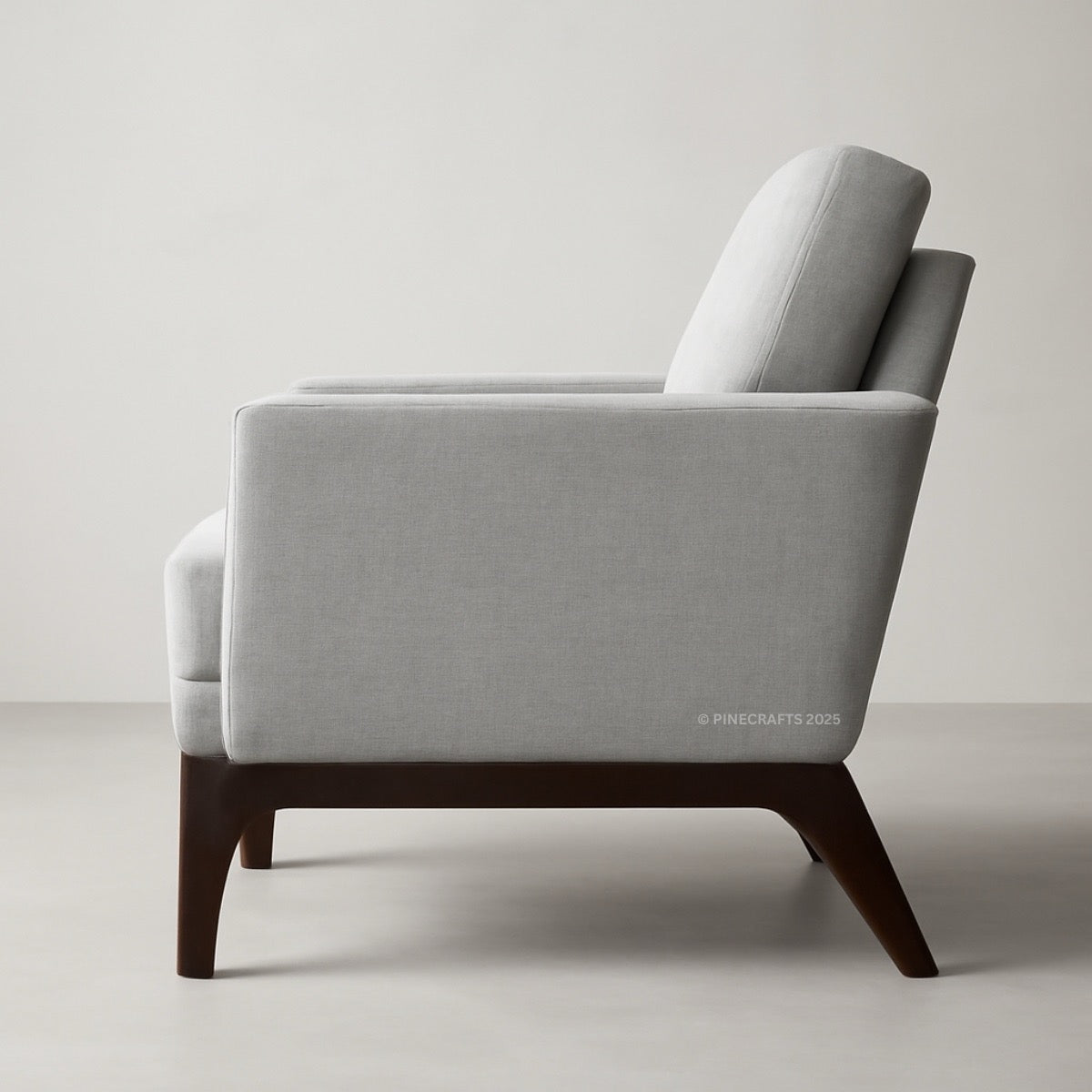 Gray armchair with wooden legs on a light gray background