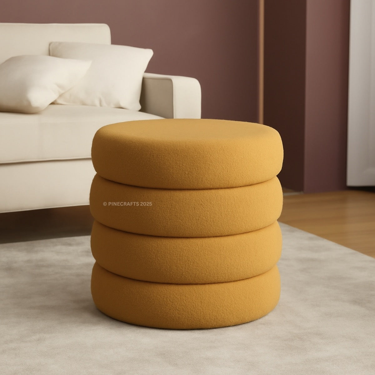 Mustard yellow ottoman with a beige sofa in the background