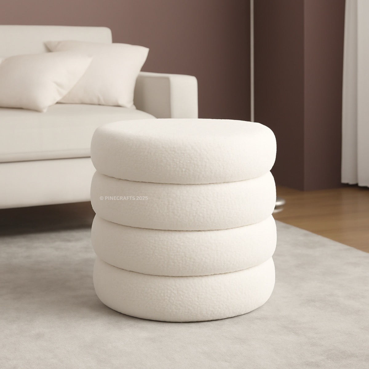 Stacked cylindrical ottoman in a modern living room setting