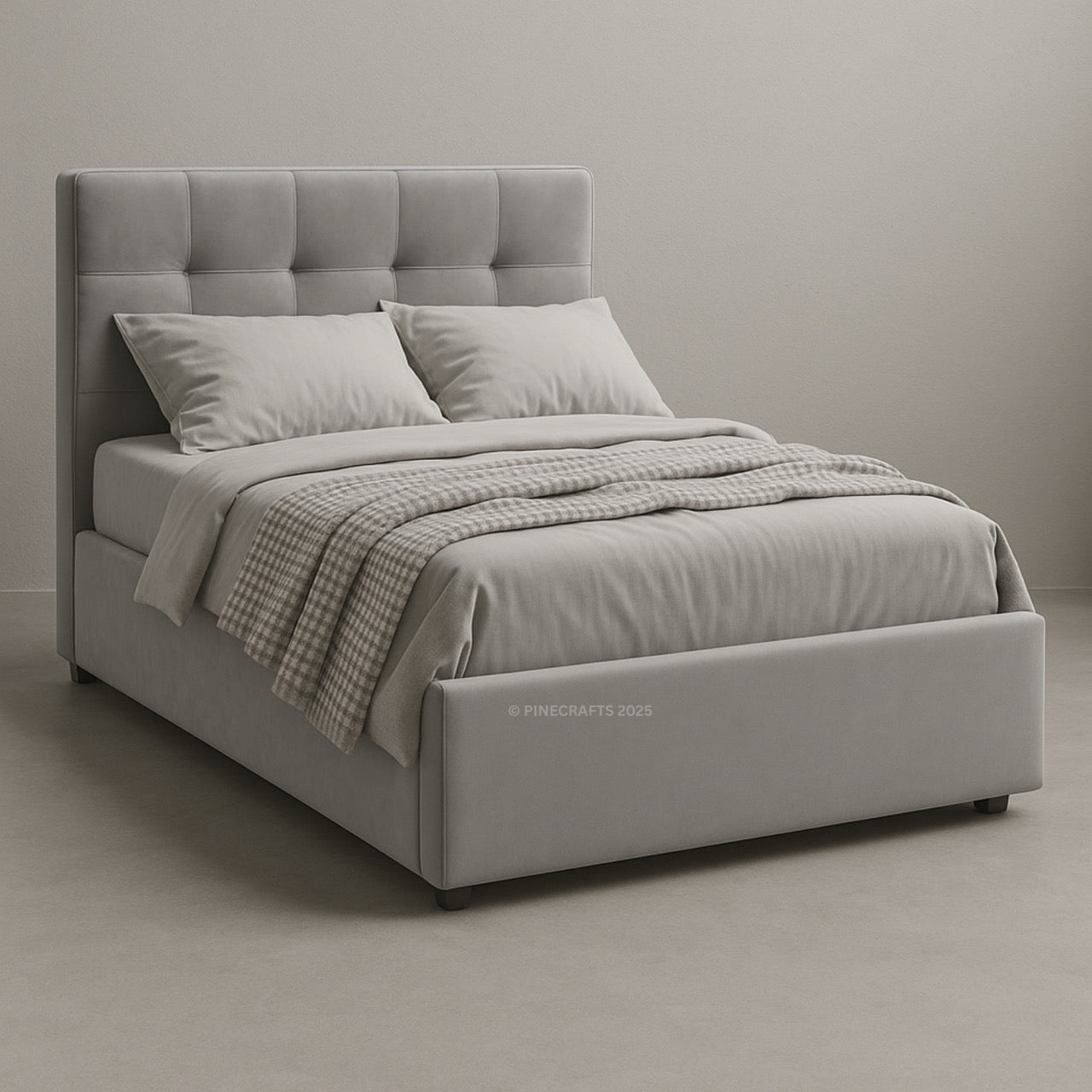 Gray upholstered bed with matching bedding in a neutral setting