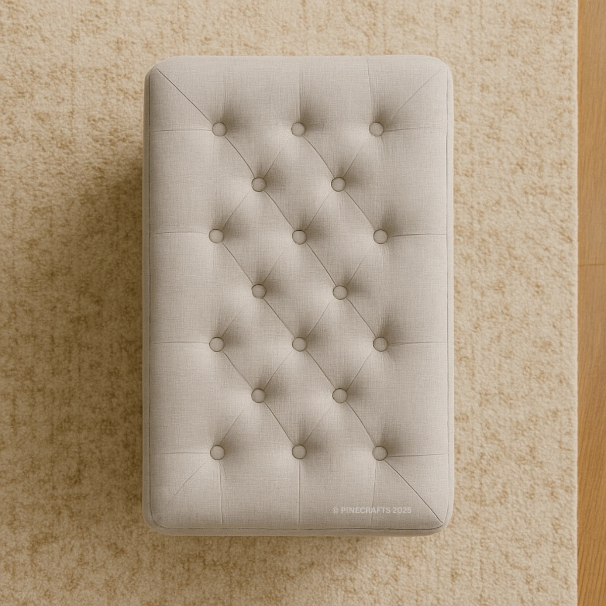 Beige tufted ottoman on a beige carpet