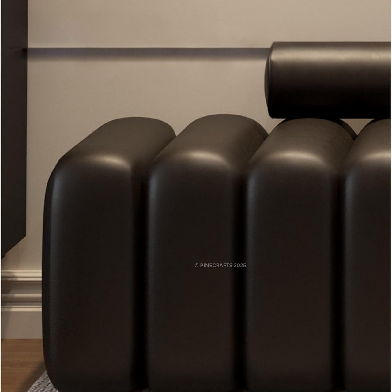 Modern black radiator against a neutral wall