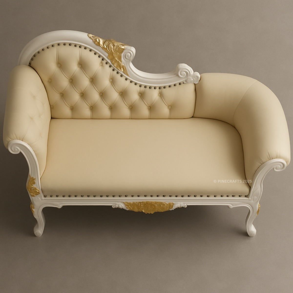 Beige and gold ornate sofa on a gray background