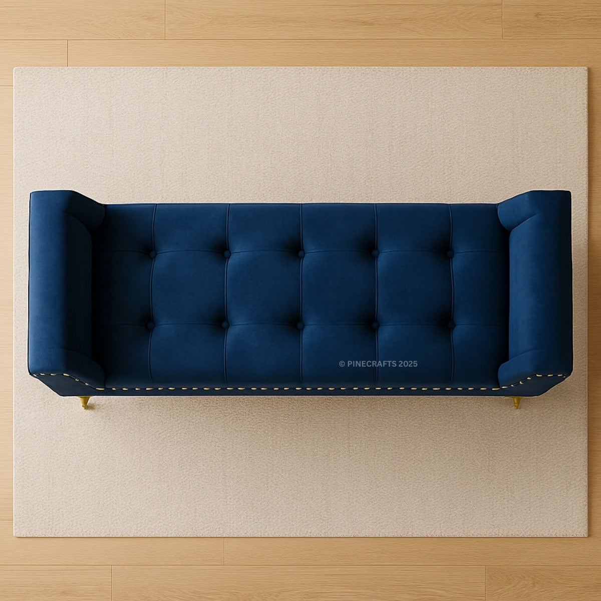 Blue tufted sofa on a beige rug with wooden floor