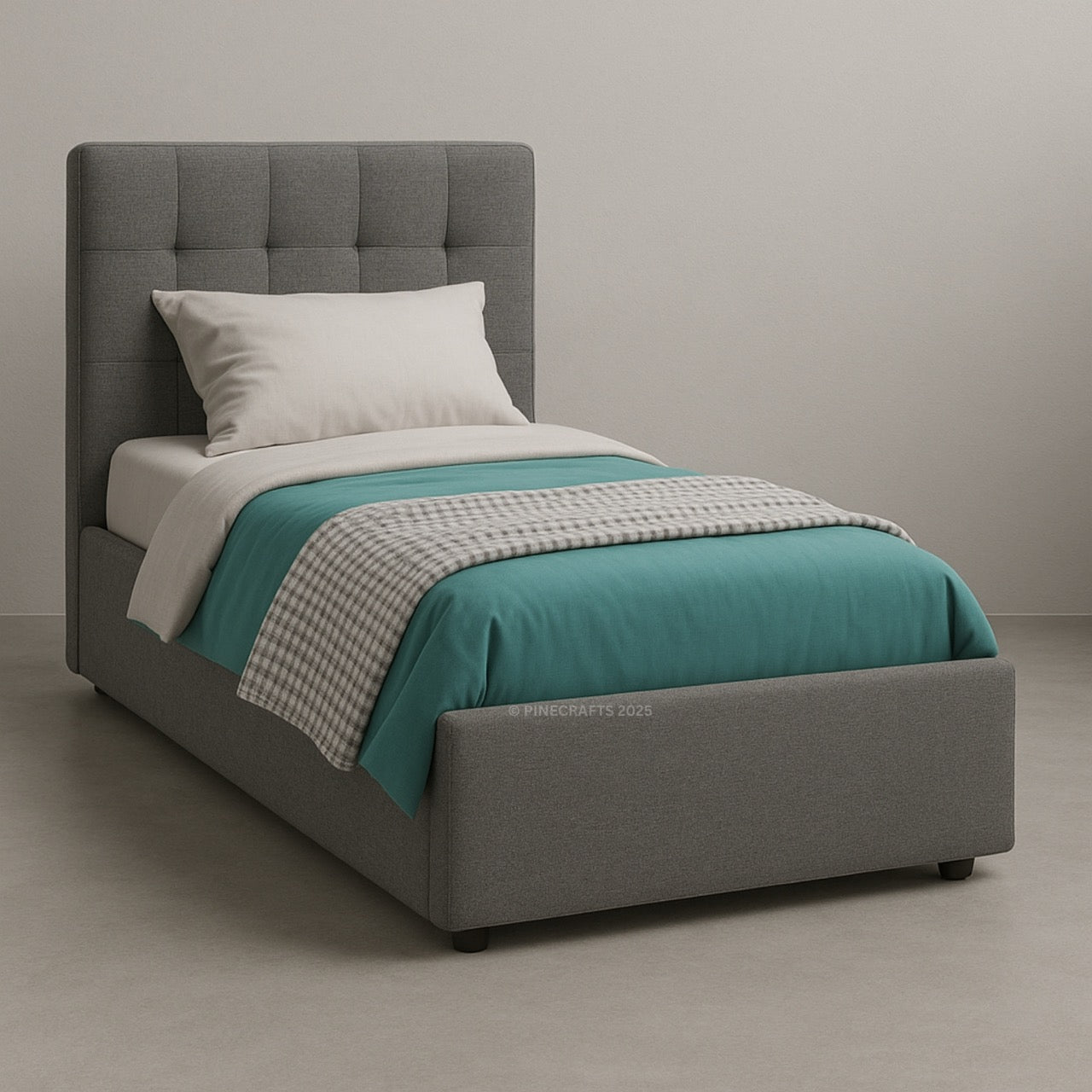 Gray upholstered bed with teal bedding and a white pillow on a neutral background
