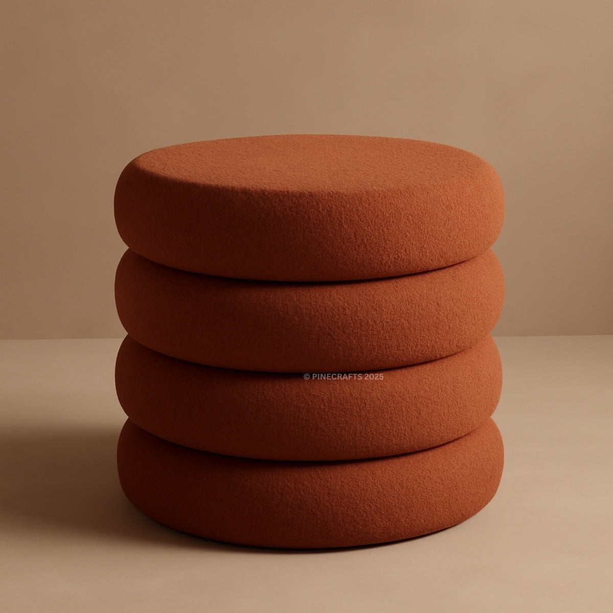 Stack of brown cushions on a beige background