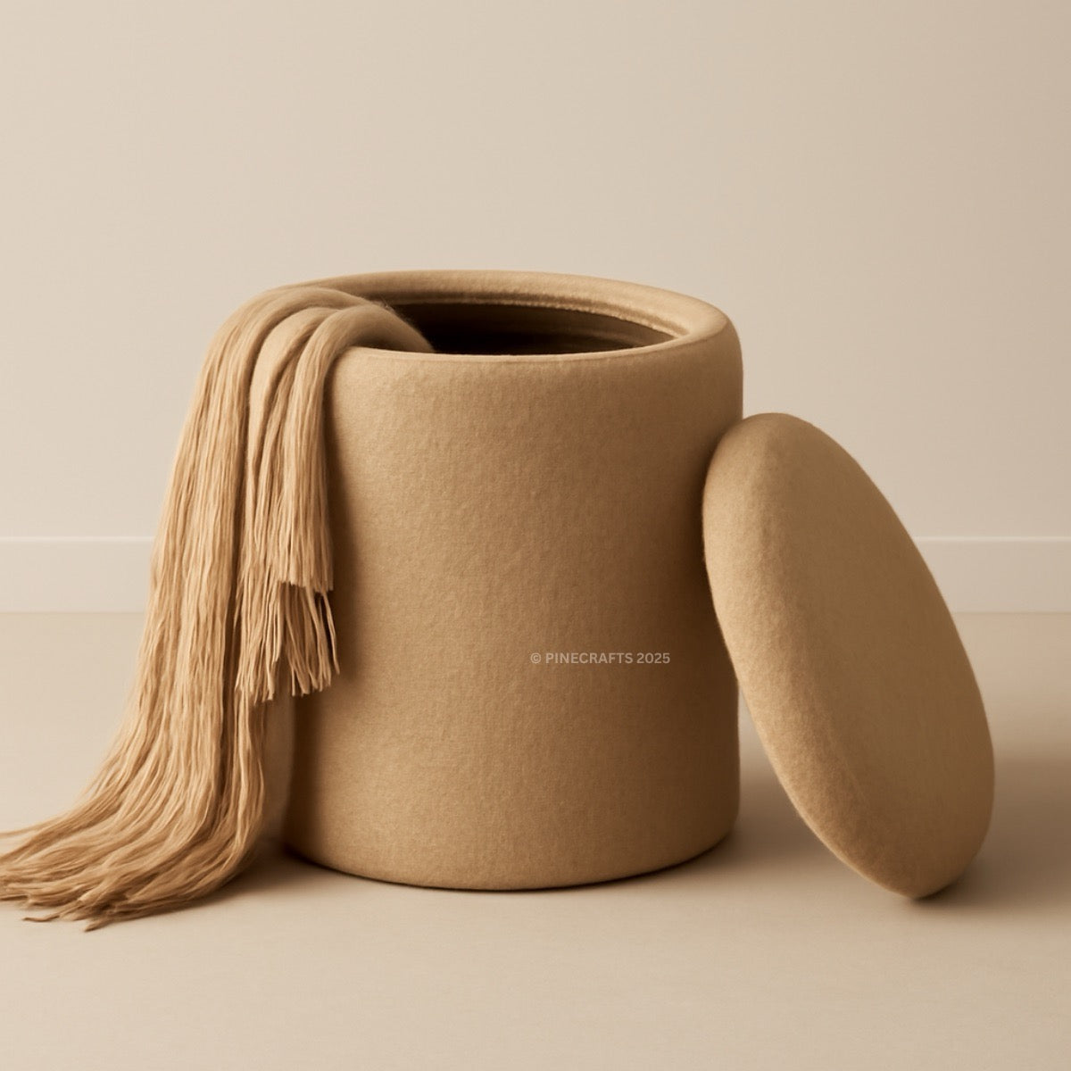 Beige fabric-covered storage jar with a matching cover on a beige background