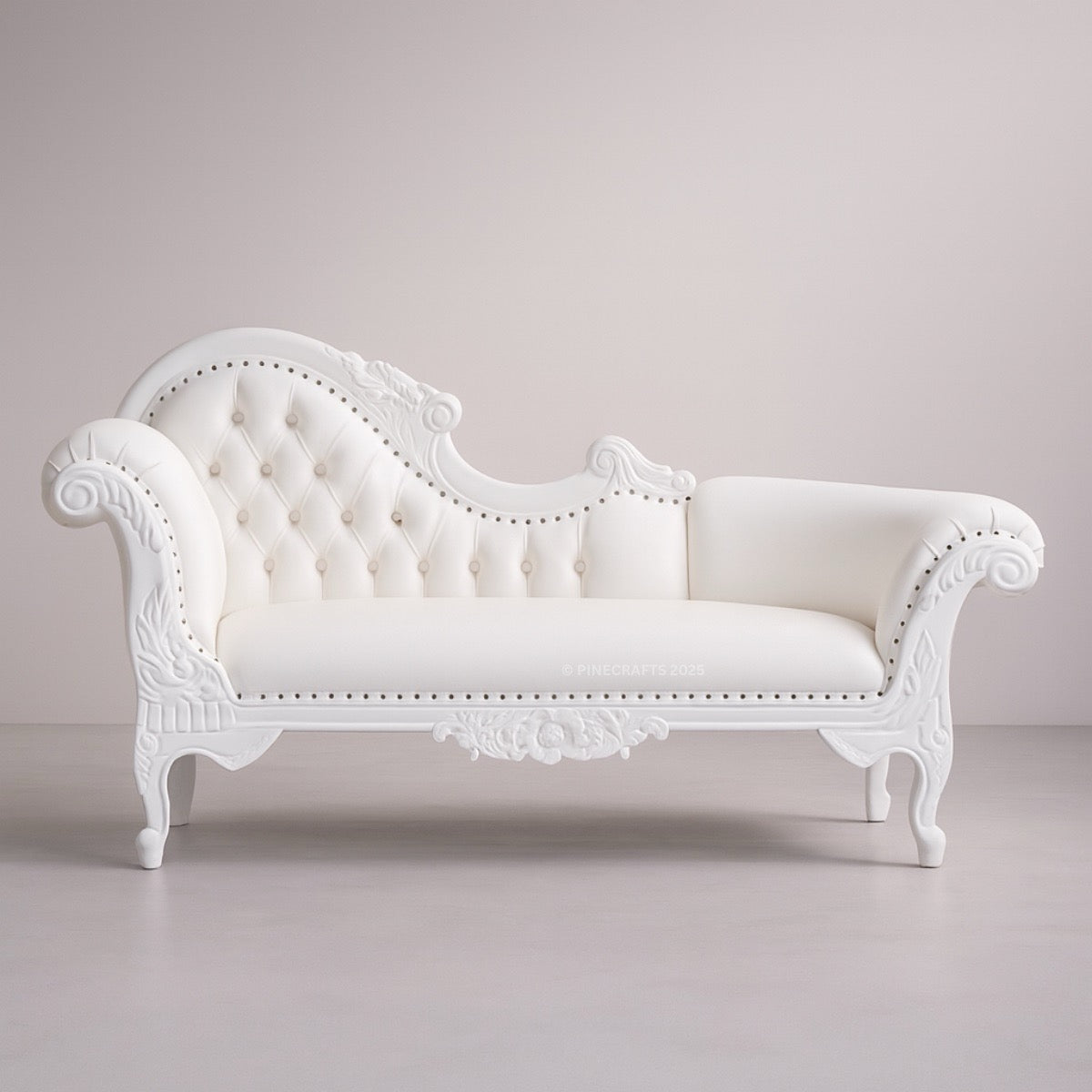 White ornate sofa on a plain background