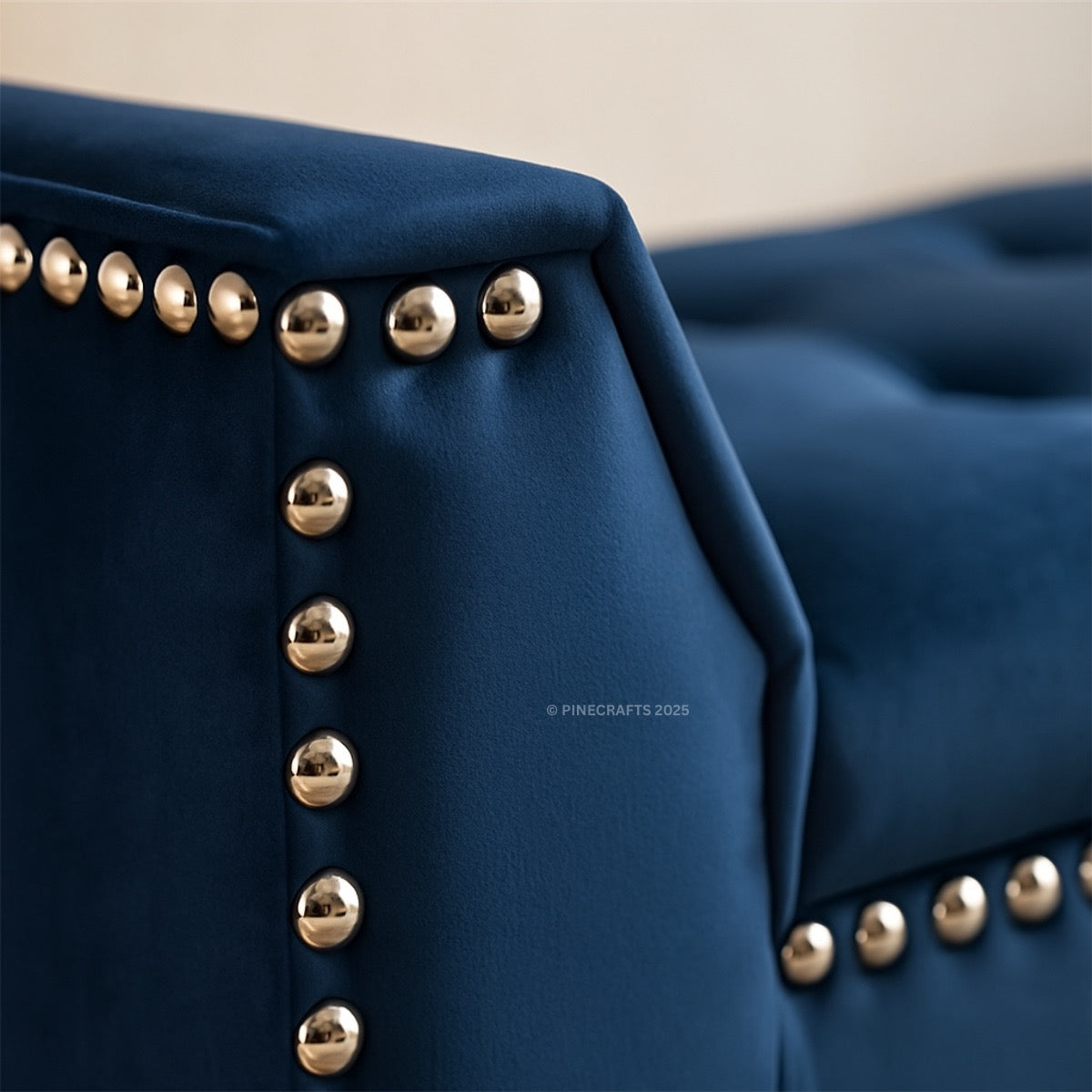 Navy blue fabric with gold buttons on a beige background