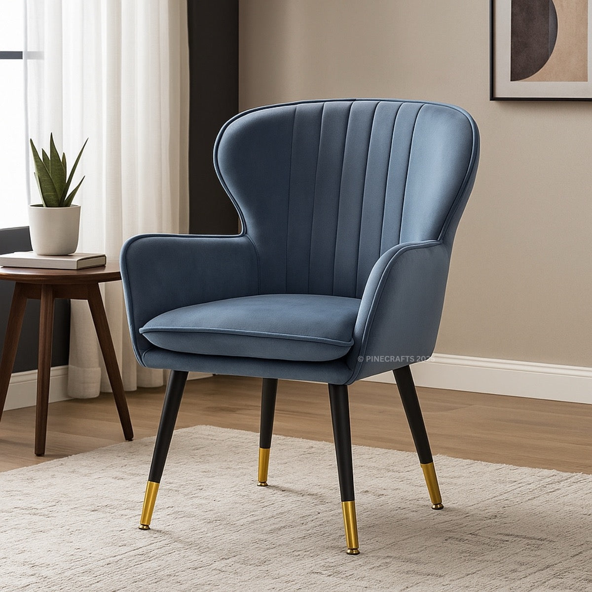 Blue armchair with gold feet in a room setting