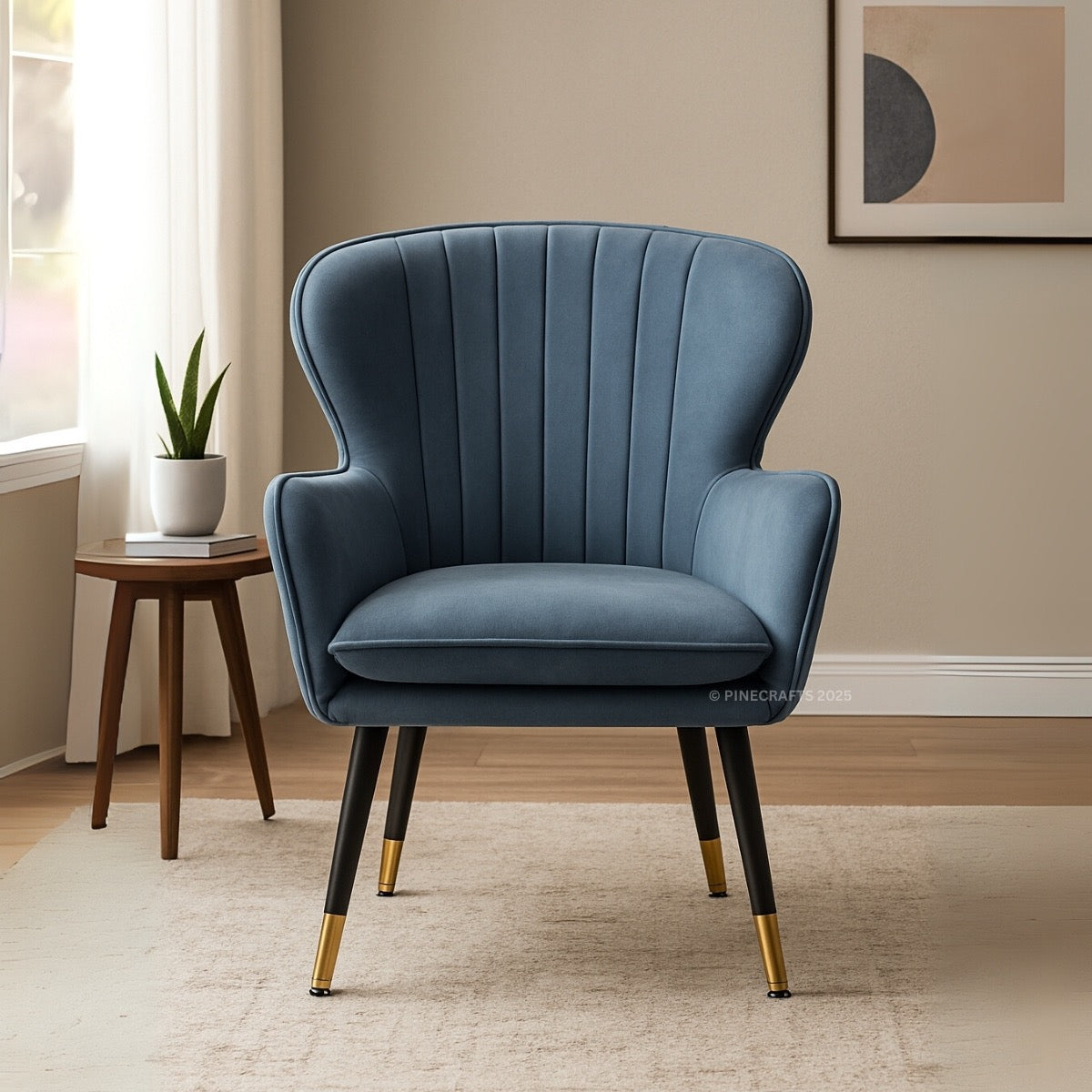 Blue armchair with gold feet in a room setting