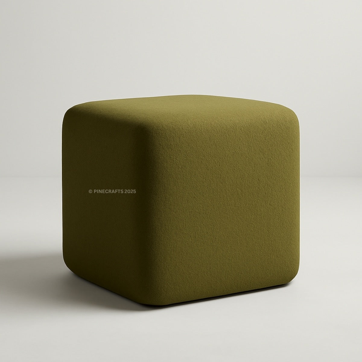 Green cube-shaped ottoman on a light gray background