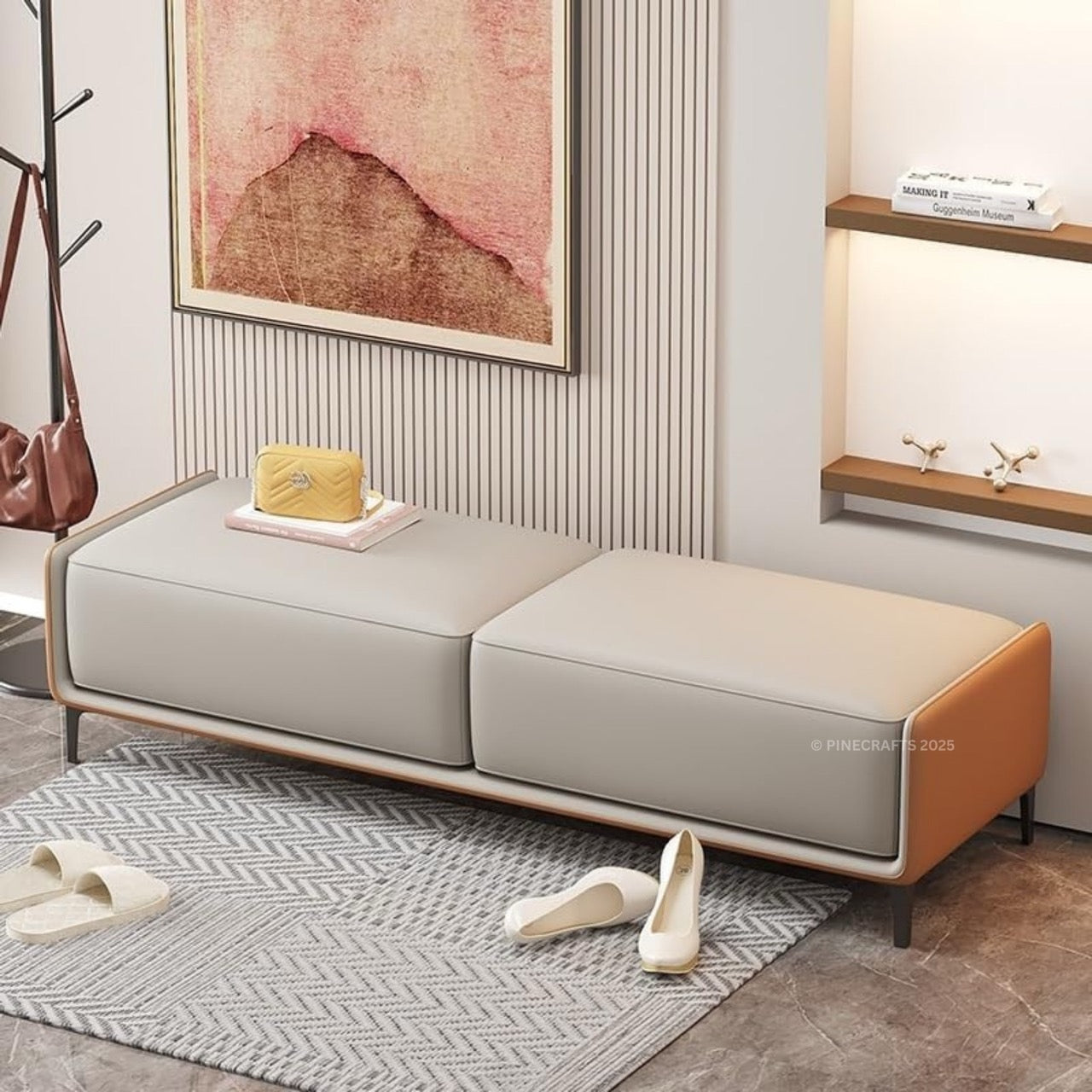 Modern bench with a wooden frame and gray cushion in a room setting.