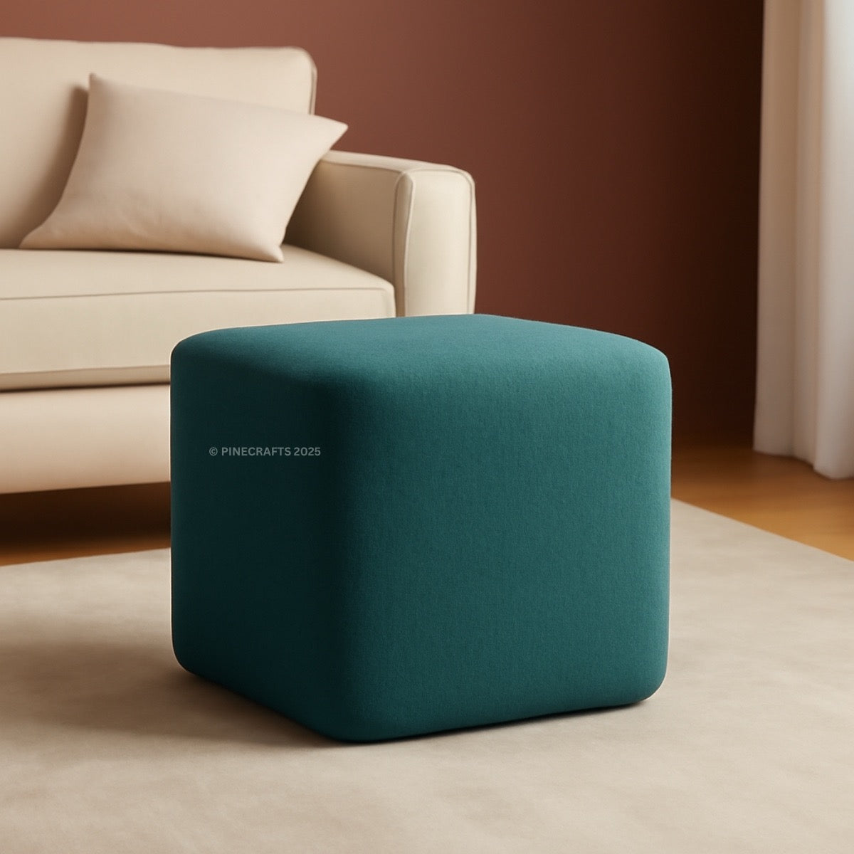 Teal cube ottoman in a living room setting with a beige sofa.