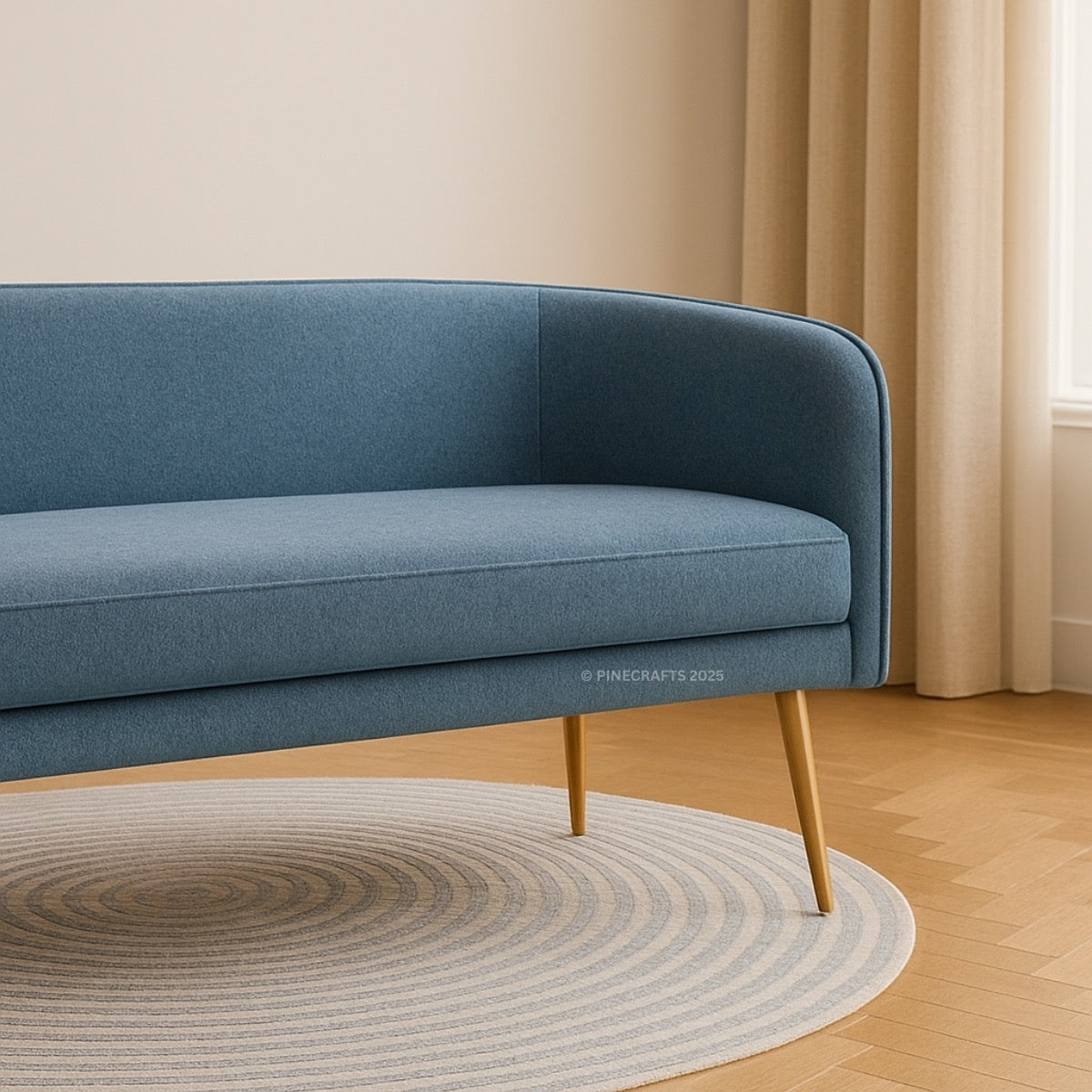 Blue sofa with wooden legs in a room with beige curtains and a circular rug.