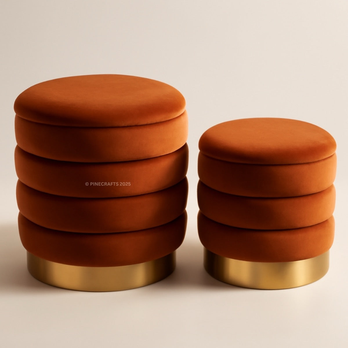 Two orange stools with gold bases on a beige background