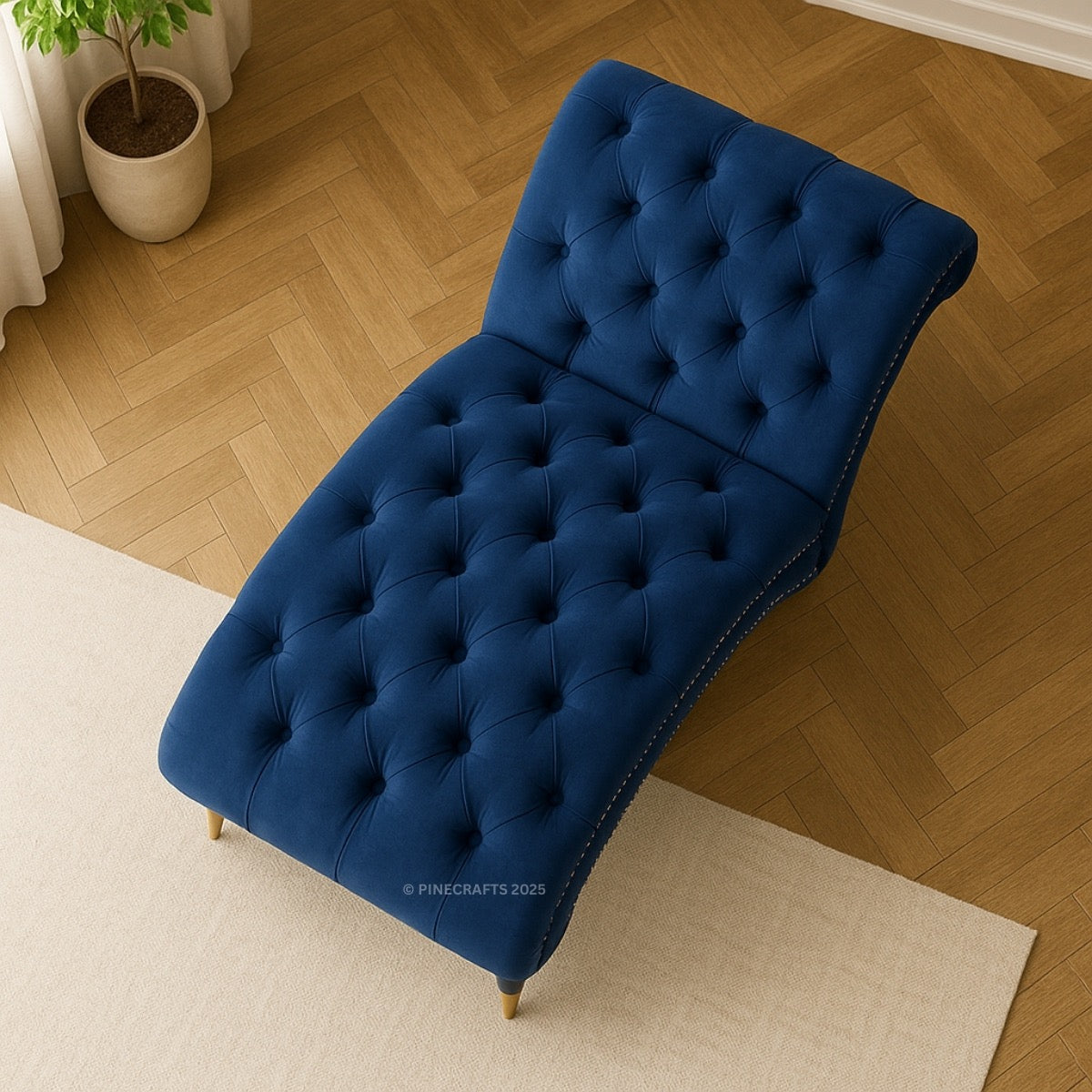 Blue tufted bench on a wooden floor with a plant in the background