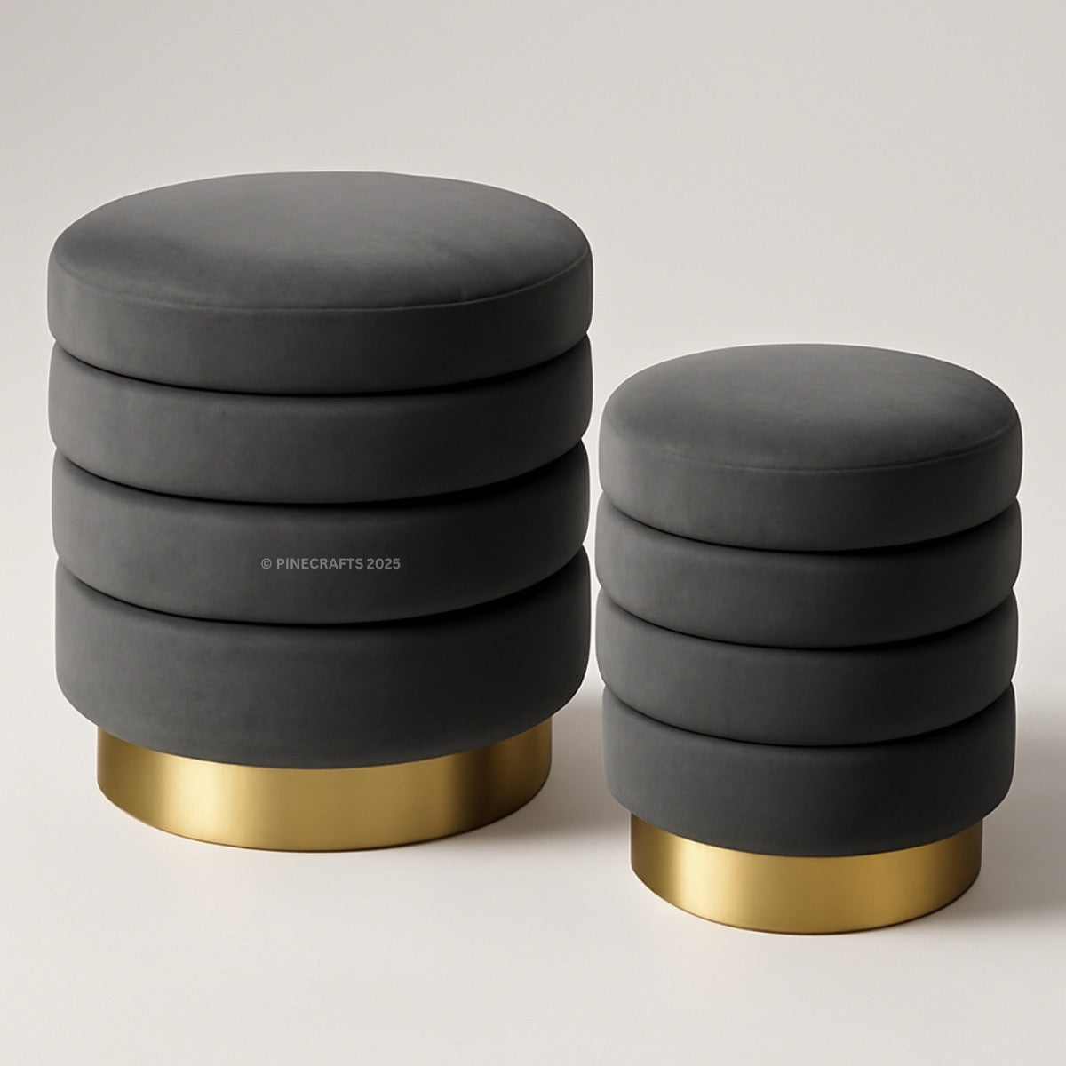 Two gray stools with gold bases on a light background
